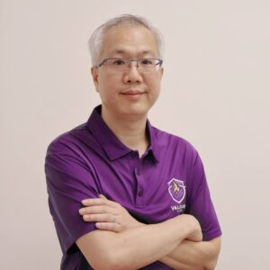 Min-Yen Kan wearing a purple Valour House polo shirt